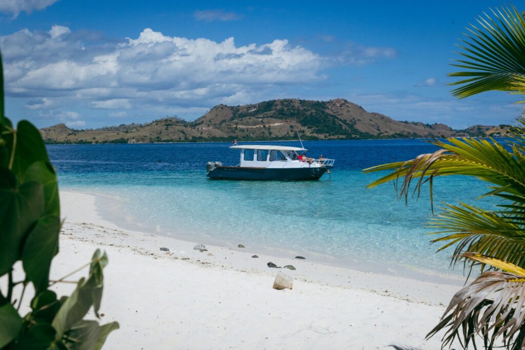 Boat on a white-sand beach